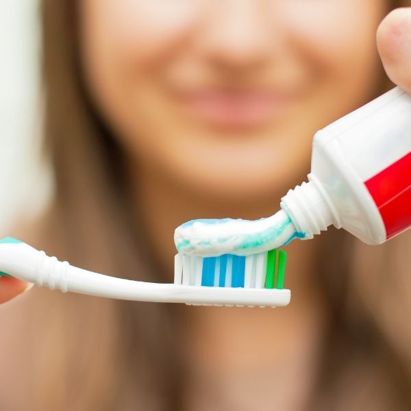 toothpaste on a toothbrush