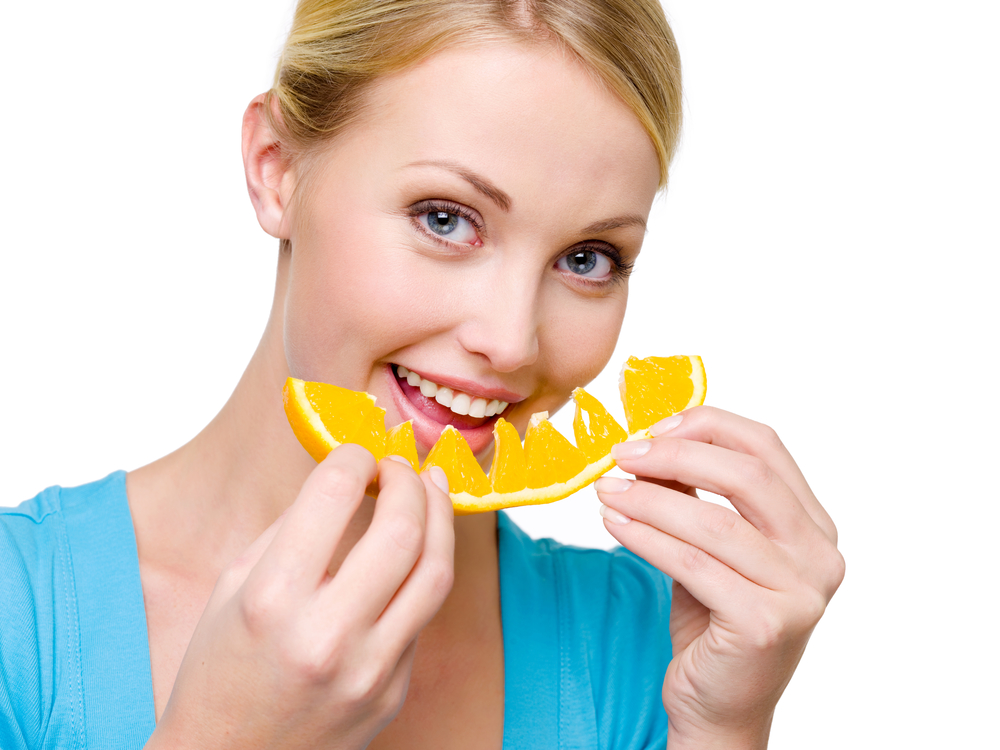 woman eats the orange