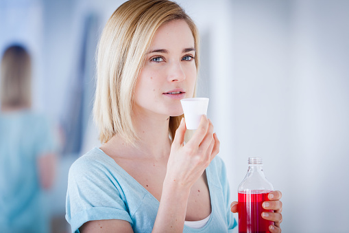 girl is holding a mouthwash