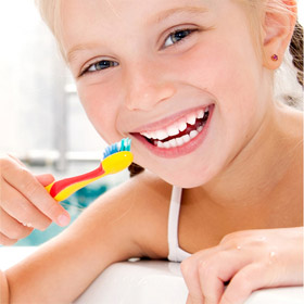 girl brushing her teeth