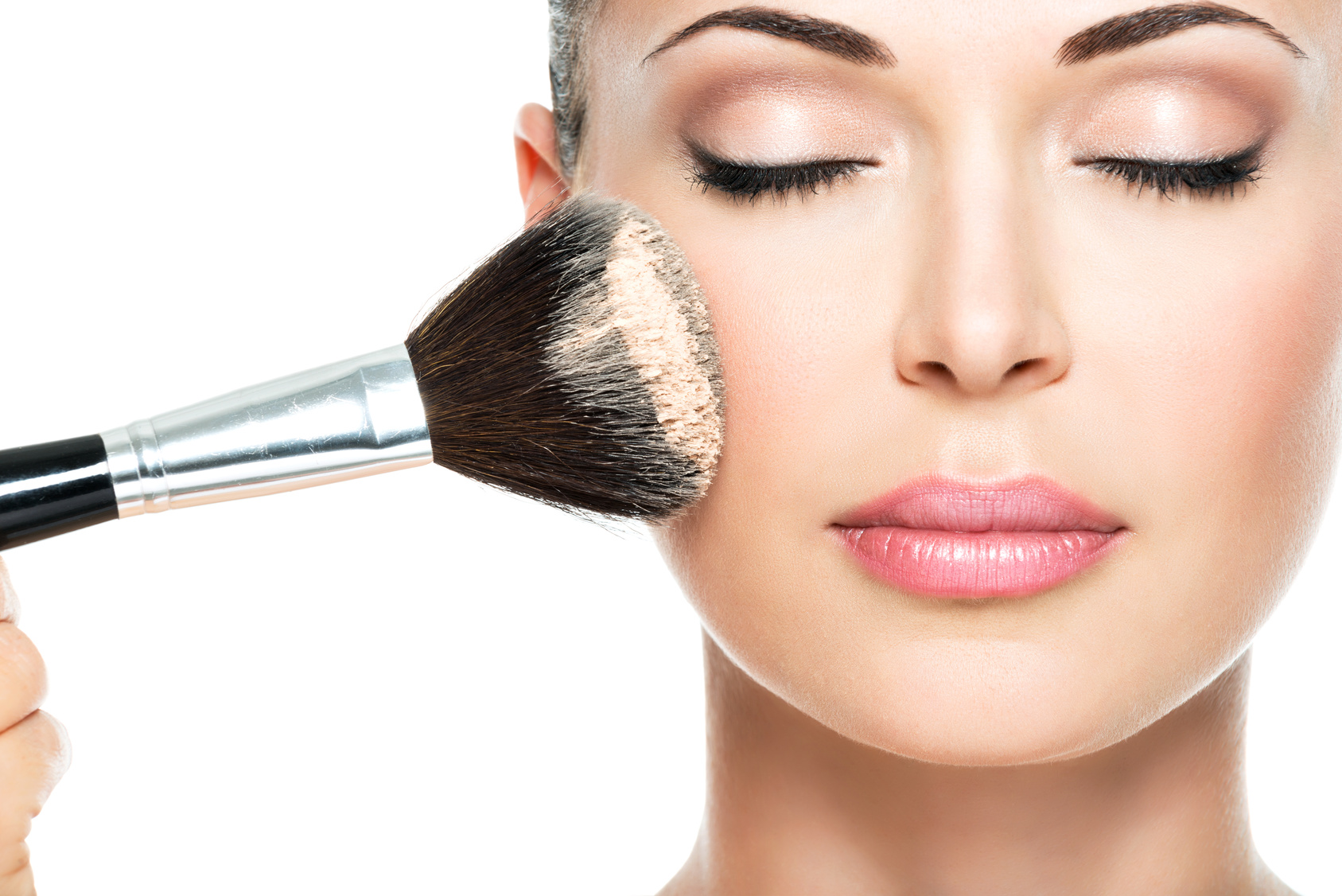 woman applying face powder